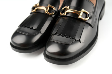 Loafers isolated on white background. Pair of Stylish Expensive Modern Leather Black Loafers Shoes. Fashion concept with woman shoes on white.