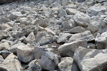 large pieces of rocks placed in front of ponds,