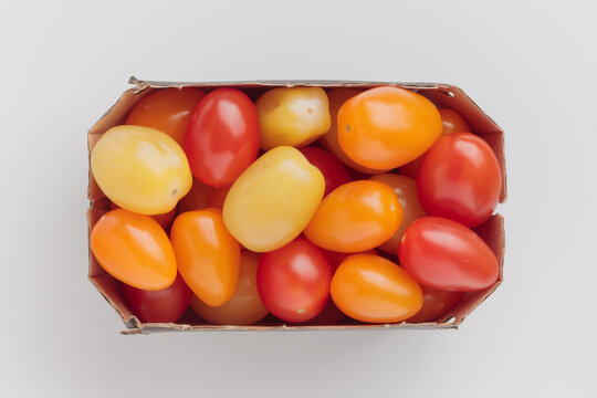 Paper basket of colorful cherry tomatoes