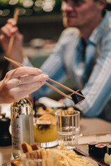 Sushi lifestyle images on the table using a chopstick 
