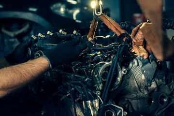 Fototapeta na wymiar Auto mechanic working in garage. Repair service.