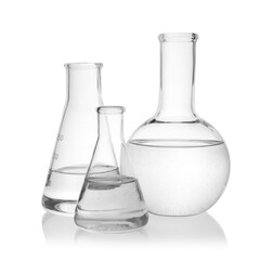 Flasks with transparent liquid on white background
