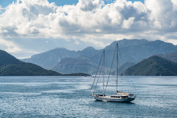 Awesome view of yacht crossing Marmaris Harbor, Turkey