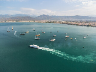 Fototapeta na wymiar Aerial view of white ship crossing Fethiye Bay, Turkey