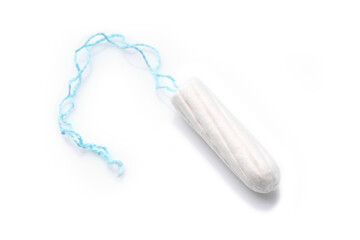 Medical female tampon on a pink background. Hygienic white tampon for women. Cotton swab. Menstruation, means of protection. Tampons on a red background.