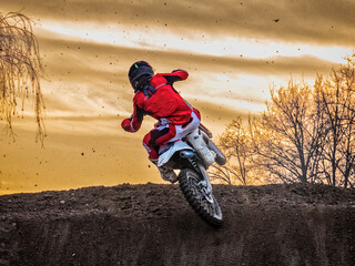 Motocross scene in sunset hours