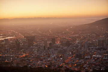 Obraz premium Here comes the sun. Aerial view of a beautiful city at dawn.