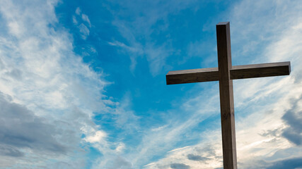 Jesus Christ cross. Easter, resurrection concept. Christian wooden cross on a background with dramatic lighting, colorful mountain sunset, dark clouds and sky, sunbeams.