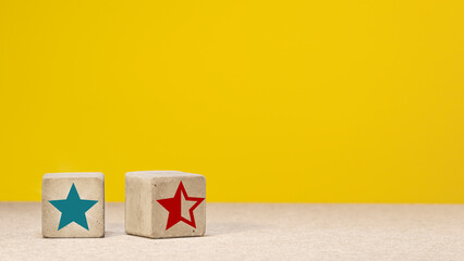 signs of stars on concrete cubes. symbol of evaluation of viewers and customers. copy space
