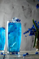 blue flowers in glass vase