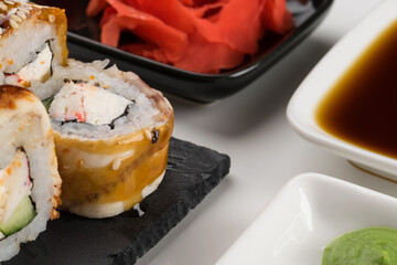 close-up of rolls with eel and sauces for them