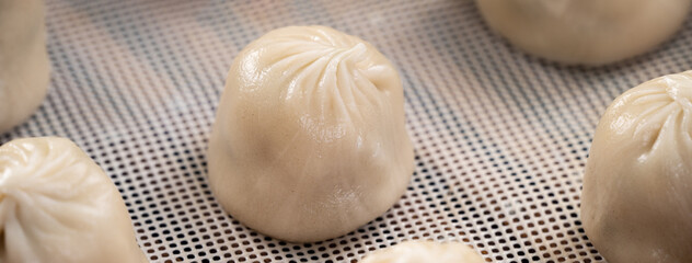 Steamed pork soup dumplings named Xiao long bao in Taiwan.