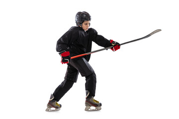 Obraz premium Active player. Sportive boy, child, hockey player in special uniform training, practising isolated over white studio background.