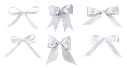 Set with beautiful silver ribbons tied in bows on white background