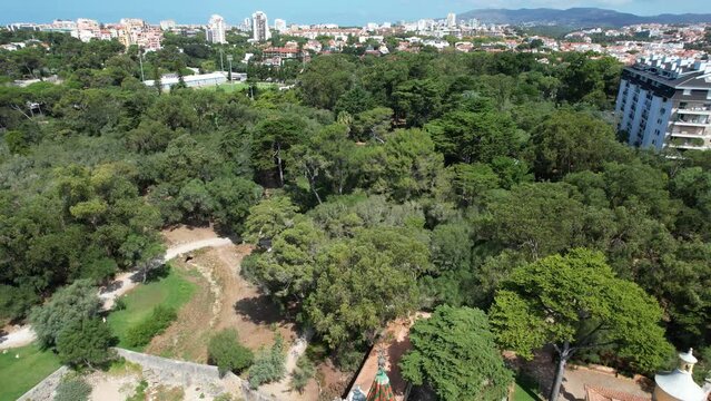 Flying backwards over museum Condes Castro Guimares, with amazing view from Cascais cityscape,Portugal
