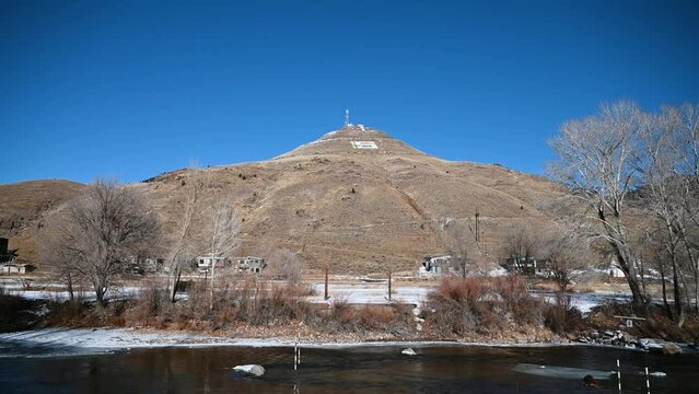 Viewing Salida's Tenderfoot S mountain from the Arkansas River during the day, handheld