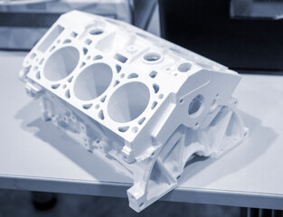 Objects prototype car motor printed on 3d printer from plastic filament close-up. Modern new...