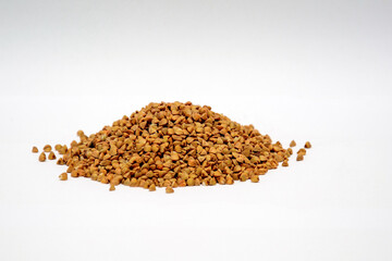 Pile of buckwheat isolated on white background.