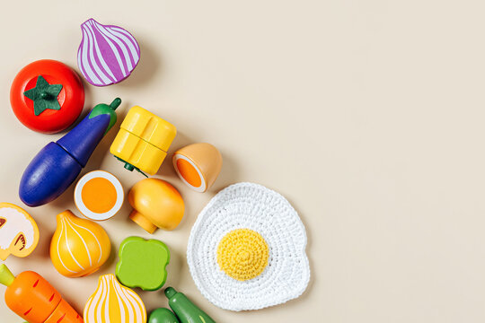 Wooden fruit play set. Sustainable wooden play pretend cutting vegetables and fruits. Cute kids toys to play in the kitchen
