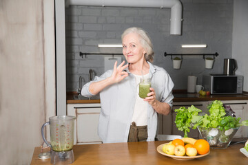 Healthy nutrition in the family, vegetarianism. Senior lifestyle. elderly woman n drink smoothie...