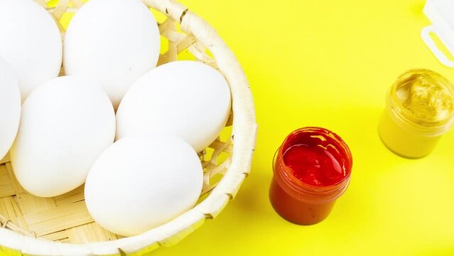 White eggs, paints, tassels, preparation for coloring for Easter