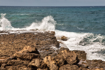 beautiful scenic waves crashing onto rocks