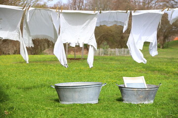 Old-fashioned laundry on a clothesline with wooden clips