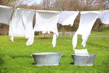 Old-fashioned laundry on a clothesline with wooden clips