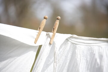 Old-fashioned laundry on a clothesline with wooden clips