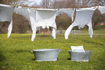 Old-fashioned laundry on a clothesline with wooden clips