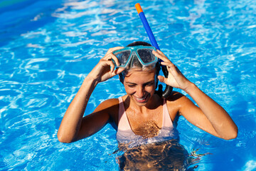 Woman snorkeling while on summer vacation