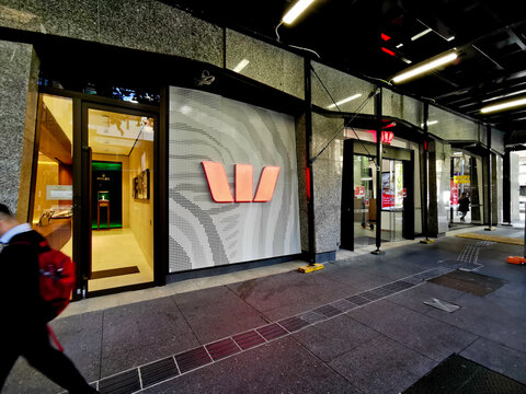 BRISBANE, AUSTRALIA - MAY 19, 2020:  Westpac Bank flagship headquarters office in Brisbane Central Business District on Queen Street. A man walks pass the branch.