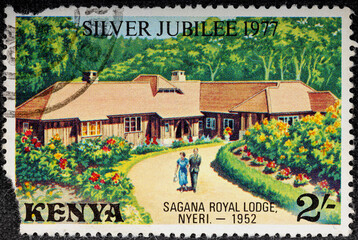 Kenya - circa 1977: A Kenyan postage stamp depicts Elizabeth II and Prince Philip at Sagana Lodge. Circa 1977.
