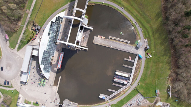 Low level aerial image of the Falkirk Wheel. Unique rotating boat-lift joining the Forth and Clyde canal and the Union Canal in Central Scotland.