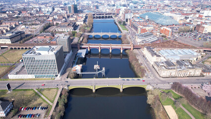 Low level aerial image over the River Clyde near to the Centre of the city of Glasgow, in Central Scotland. With panoramic view over the cityscape.