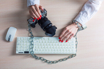 Copyright. The camera is chained to the photographer's hand. The concept of protecting the...