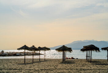 Women lying on the beach at sunset
