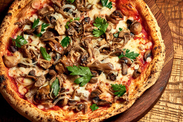 Meat pizza with mushroom, red sauce and sesame seeds on a wooden board on a wooden background. Selective focus