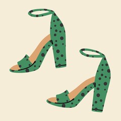 Women's green polka-dot high-heeled sandals. Fashionable shoes with a pattern. Flat design, hand drawn cartoon, vector illustration.