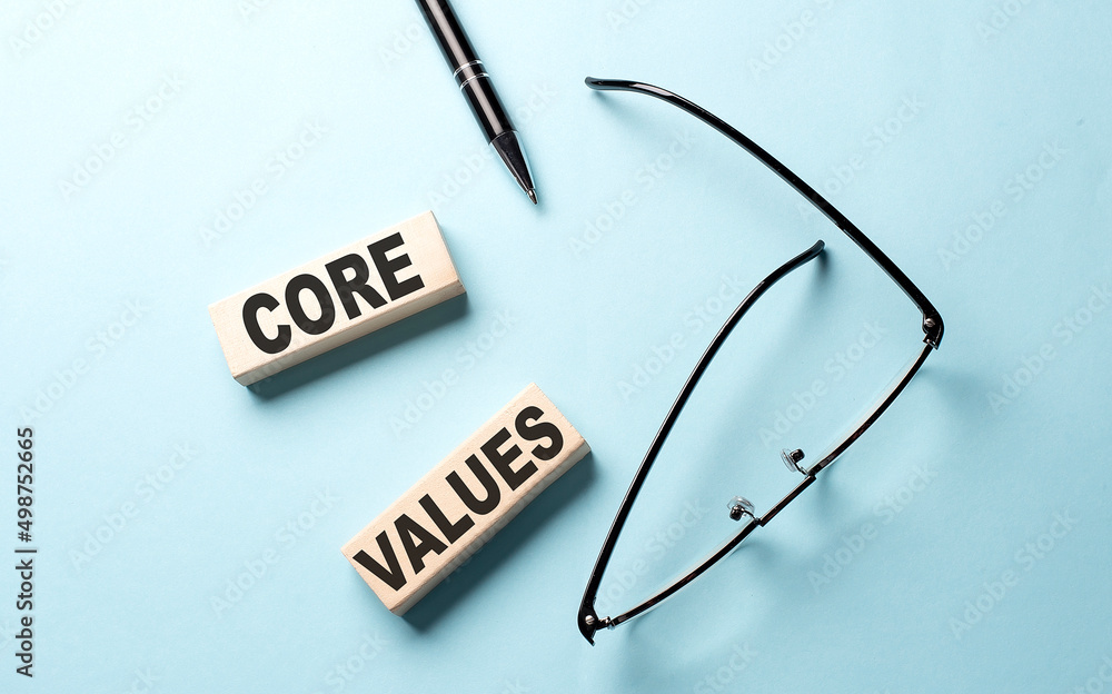 Poster core values text on the wooden block ,blue background
