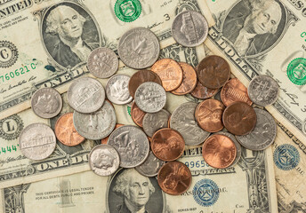 One dollar bills and cents coins spread
