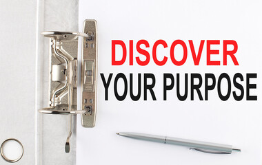 DISCOVER YOUR PURPOSE text on the paper folder with pen. Business concept