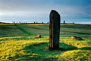 Neolithic prehistoric stone circle The Ring of Brodgar, Orkney, Scotland. Looking NW from the Comet Stone in the foreground