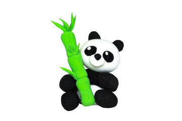 Plasticine panda with bamboo. Isolated on white