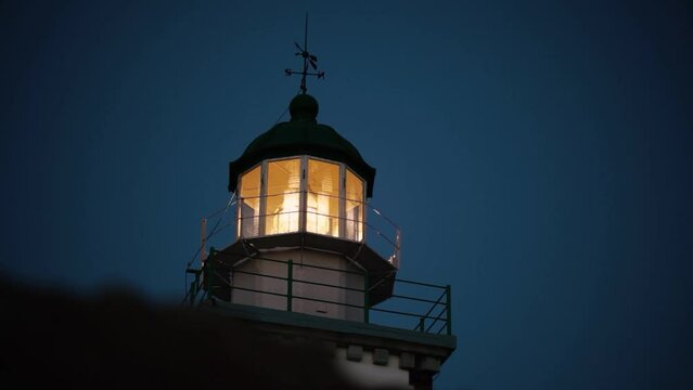 Lighthouse, evening, lantern, lighthouse light, lighthouse spinning, on the island, Santorini, Greece getting dark speed up video