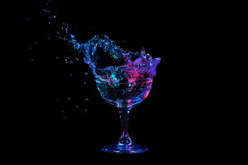 Set huge colorful splash party drink with blue and red color, isolated on black background