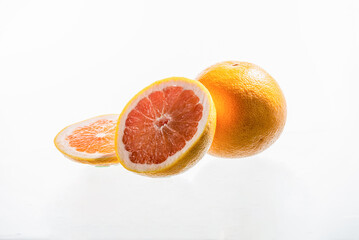 Grapefruit and grapefruit half isolated on white background.  Pink,orange Fresh grapefruit citrus fruit, slice with zest