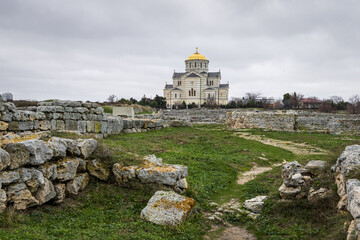 Fototapeta na wymiar Ruins of the ancient city of Chersonese. View of a large church and ruined old stone buildings. Chersonesus Cathedral (Saint Vladimir Cathedral). Sights of the Crimean peninsula. Sevastopol, Crimea.