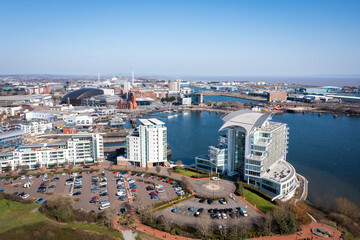 Naklejka premium Aerial view of Cardiff Bay, the Capital of Wales, United Kingdom 2022 on a clear sky spring day