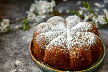 Homemade  Italian style  Easter  bread cake, spring blossom  and  hand colored eggs. Homemade pastry.  Easter holiday baking and decorarion